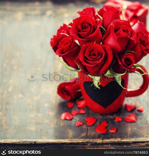 Valentine composition with roses and hearts on wooden background