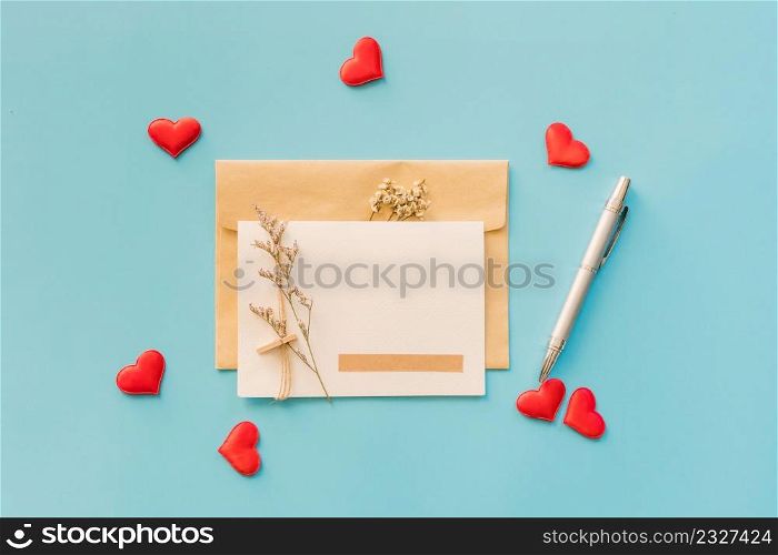 Valentine greeting card and red heart on blue background, copy space for text