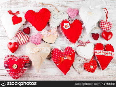 Valentine handmade hearts on the shabby wooden table