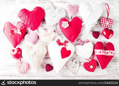 Valentine handmade hearts on the shabby wooden table