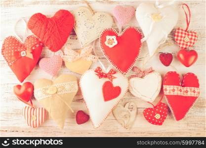 Valentine handmade hearts on the shabby wooden table. Valentine handmade heart