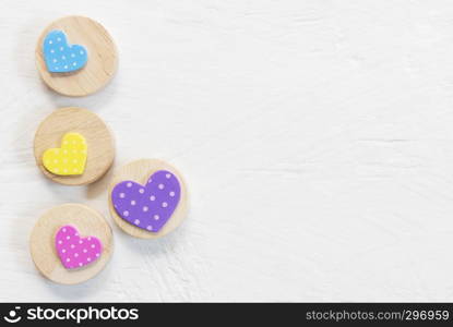 Valentine, love and wedding background concept. Colorful heart on white wood table. Picture for add text message. Backdrop for design art work. Sweet and pastel color tone.