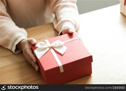 Valentine present. Gift box and red ribbon for romantic couple