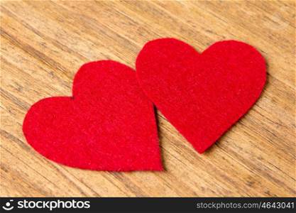 Valentine red hearts on rustic wooden background