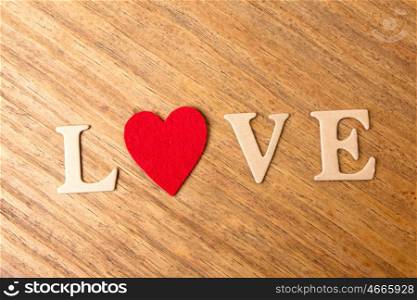 Valentine red hearts on rustic wooden background