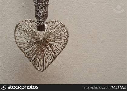 Valentine&rsquo;s Day. A heart made out of silver on a black background