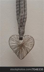 Valentine&rsquo;s Day. A heart made out of silver on a black background
