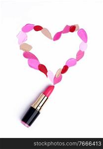 Valentine&rsquo;s Day background. Red and pink lipstick smeared in the shape of heart. Isolated on white background. Cosmetic products