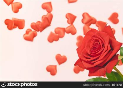 Valentine&rsquo;s day background,Red rose with red hearts on pink background,For card and wedding background. Copyspace. Valentine&rsquo;s day background,Red rose with red hearts on pink background,For card and wedding background