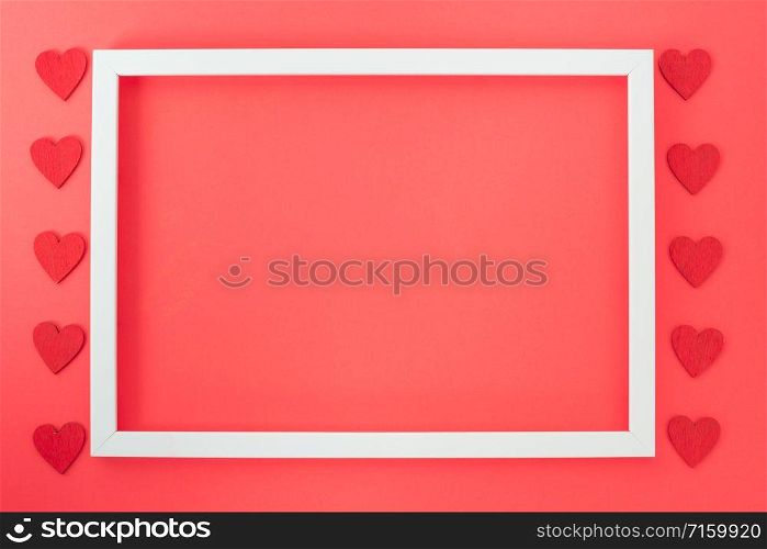 Valentine&rsquo;s Day background, Top view Flat lay Red heart round photo frame on red background. Valentines day concept with copy space