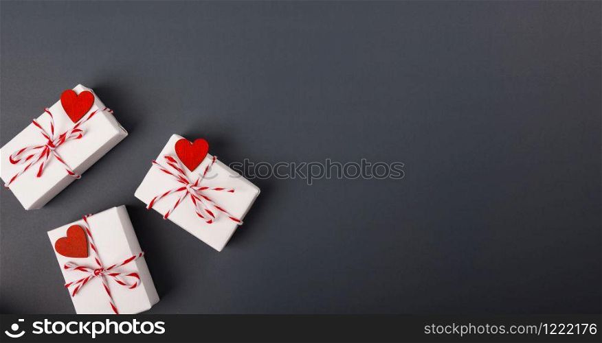 Valentine&rsquo;s day Concept, flat lay top view, White Gift Box and Red Heart on Gray background with copy space for your text