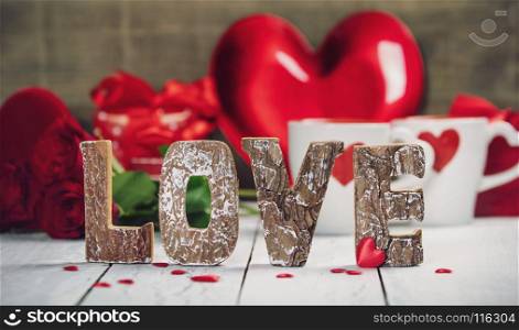 Valentine's Day concept. Love wooden letters on rustic background