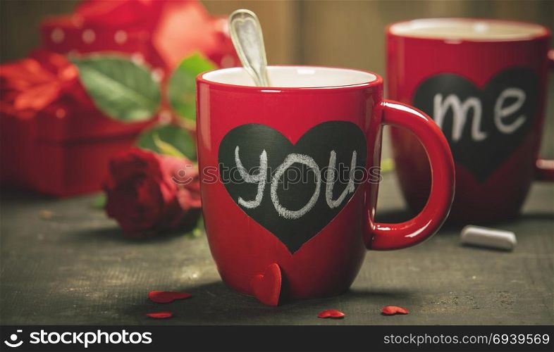 Valentine&rsquo;s Day concept. Red Cups, gift boxes and roses on a Wooden Background. Love or Valentine&rsquo;s Day Concept.