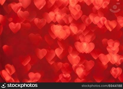 Valentine&rsquo;s Day Concept: Red Sparklng Defocused Romantic Background of Lights Hearts..