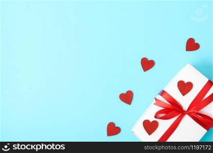 Valentine&rsquo;s Day Concept, Top view Flat lay, gift box and red heart on blue background with copy space for your text