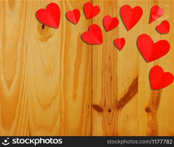 Valentine&rsquo;s Day. heart shaped red paper on a wooden background