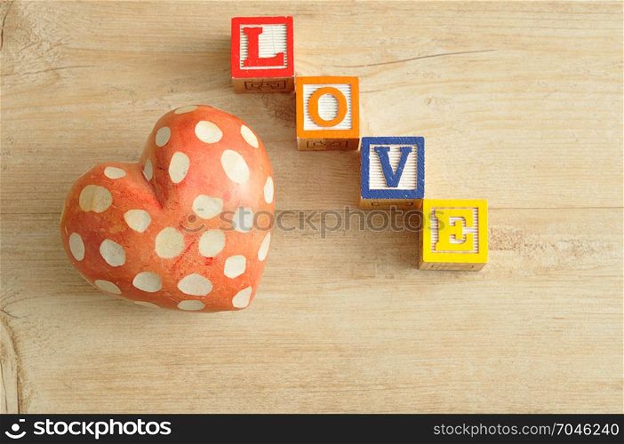 Valentine&rsquo;s Day. Love spelled with colorful alphabet blocks and a red heart