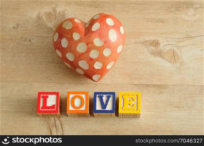 Valentine&rsquo;s Day. Love spelled with colorful alphabet blocks and a red heart