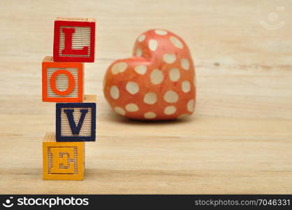 Valentine&rsquo;s Day. Love spelled with colorful alphabet blocks and a red heart