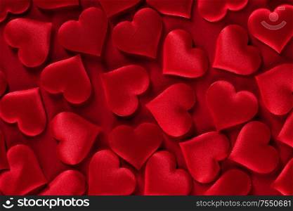 Valentine&rsquo;s day many red silk hearts background, love concept. Valentines day hearts background