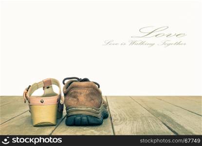 Valentine's Day or Love and Romantic Concept Background in Vintage Style for Loving or Relationship or Wedding Design Consist of Man's Shoes and Woman's Shoes on Wood Floor. Love is Walking Together.
