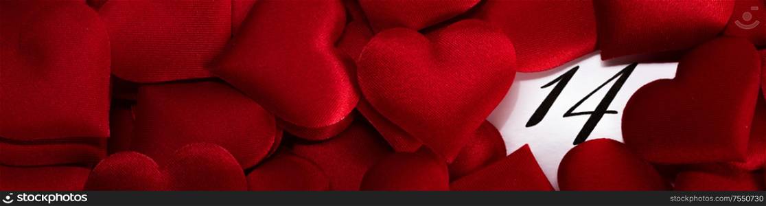 Valentine&rsquo;s day red silk hearts on calendar with 14 february date background, love, celebration concept. Valentine&rsquo;s day calendar