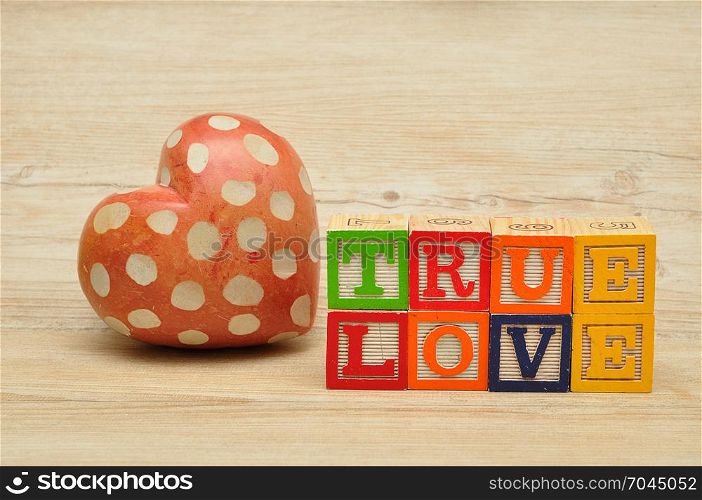 Valentine&rsquo;s Day. True love spelled with colorful alphabet blocks and a red heart