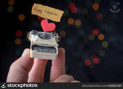 Valentine&rsquo;s day wording on torn typewriter as Love concept