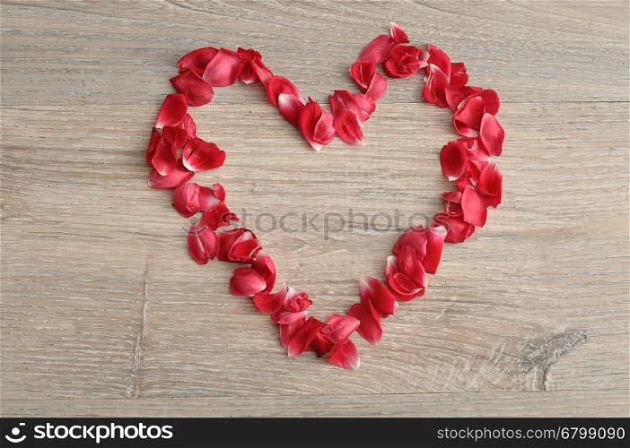 Valentine's Day. A heart made out of red rose petals