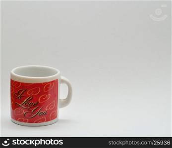 Valentine's Day. A small red mug with the lettering I love you