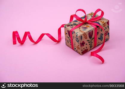 valentine"s day accessory, gift wrapped with pink ribbon, valentine"s day decoration on February 14, pink background. valentine"s day decoration on February 14, gift wrapped with pink ribbon, valentine"s day accessory