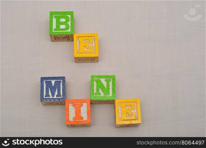 Valentine's Day. Be Mine Spelled with colorful alphabet blocks