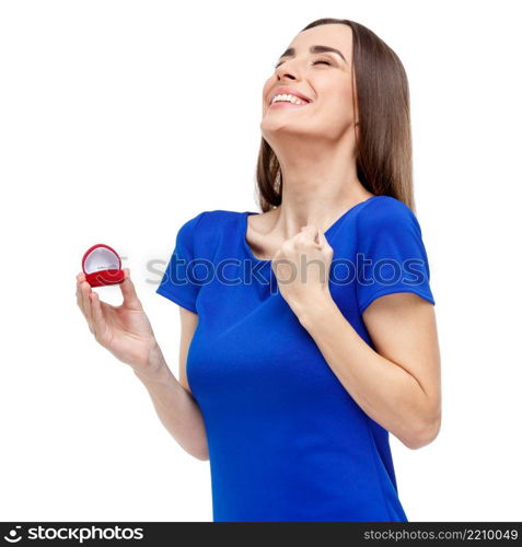 Valentine’s Day. Beautiful woman holding heart shaped box with ring. Beautiful woman holding heart shaped box with ring