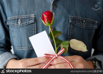 Valentine?s day concept, Hand holding red rose, love symbolic, and blank white paper note card