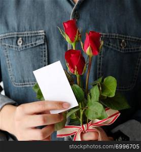 Valentine?s day concept, Hand holding red rose, love symbolic, and blank white paper note card