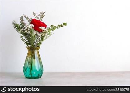 Valentine’s day concept, Red roses flower bouquet in glass vase on table background with copy space , Banner for mock up, template