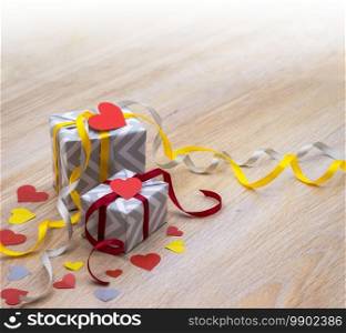 valentine"s day decor, grey gift with yellow ribbon, grey packaging with red ribbon, valentine"s day february 14. grey gift with yellow ribbon, grey packaging with red ribbon, valentine"s day february 14, valentine"s day decor