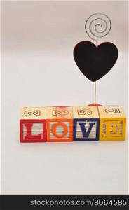Valentine's Day.Love Spelled with colorful alphabet blocks and a black heart