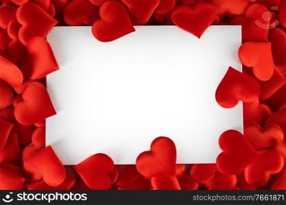 Valentine’s day many red silk hearts background , border frame isolated on white with copy space, love concept. Valentines day hearts frame