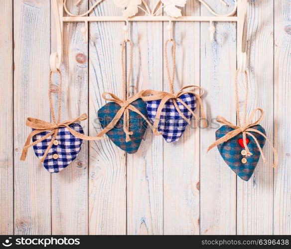 Valentine vintage decor - blue gingham hearts on the hooks. Christmas felt hearts