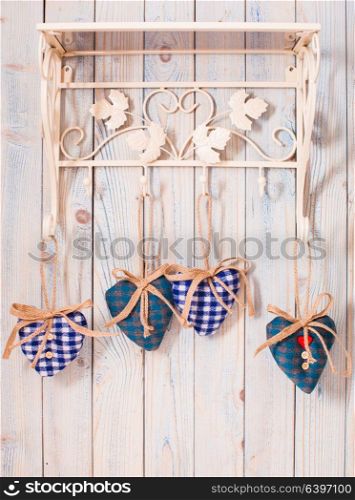 Valentine vintage decor - blue gingham hearts on the hooks. Christmas felt hearts