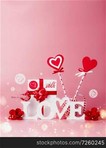 Valentines day background. Composition With Love message, gift box, red ribbons and hearts lollipops. Festive greeting concept. Romantic Love declaration concept. Copy space for your design
