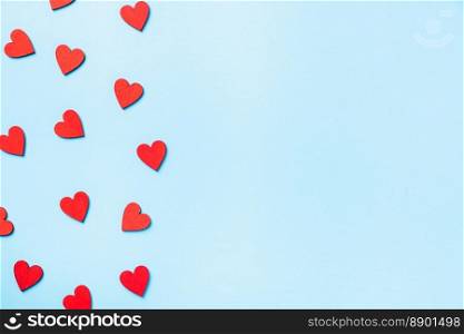 Valentines’ day background. red hearts composition greeting card for love Valentines day concept isolated on blue background with copy space. Top View flat lay from above