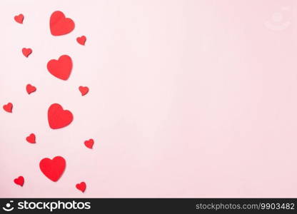 Valentines’ day background. red hearts composition greeting card for love Valentines day concept isolated on pink background with copy space. Top View flat lay from above