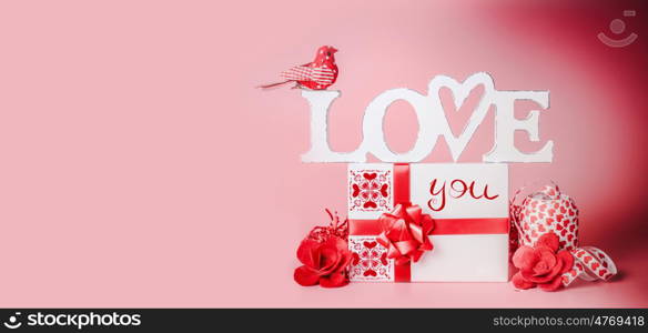 Valentines day background. Romantic composition with Love you message, gift box, red ribbons and hearts. Festive greeting concept. Love declaration concept. Copy space for your design. Banner