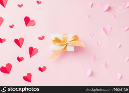 Valentines’ day background. White gift box postcard and paper flying elements hearts cut greeting gift card on pink background, Symbol of love. Happy Mother’s, Valentine’s Day concept