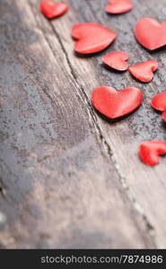 Valentines Day background with hearts on wooden background