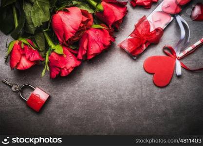 Valentines day background with pretty red roses bunch, heart, gift Candles, lock and key, top view, border