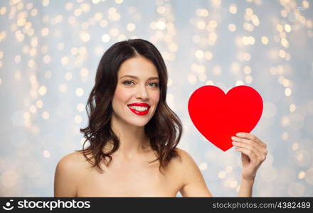 valentines day, beauty and people concept - happy smiling young woman with red lipstick and heart shape over holidays lights background. beautiful woman with red lipstick and heart shape. beautiful woman with red lipstick and heart shape