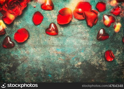 Valentines day border with red roses,petals and hearts , top view